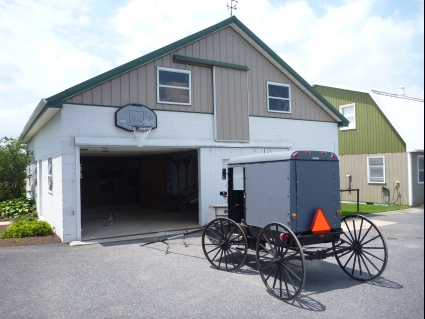 Traditional buggy outside an Amish house - photo by Rob McFarland